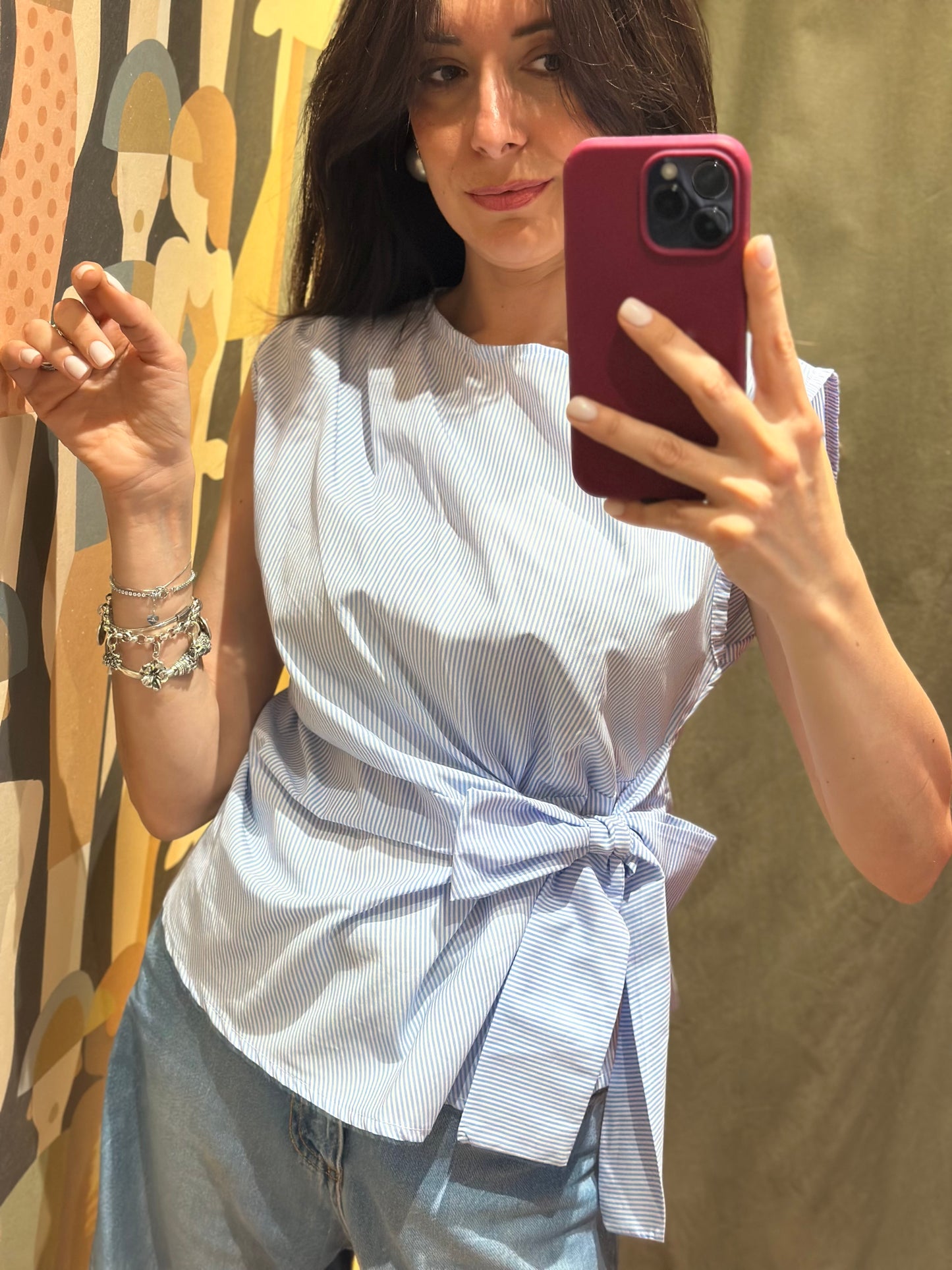 Top celeste millerighe con fiocco laterale