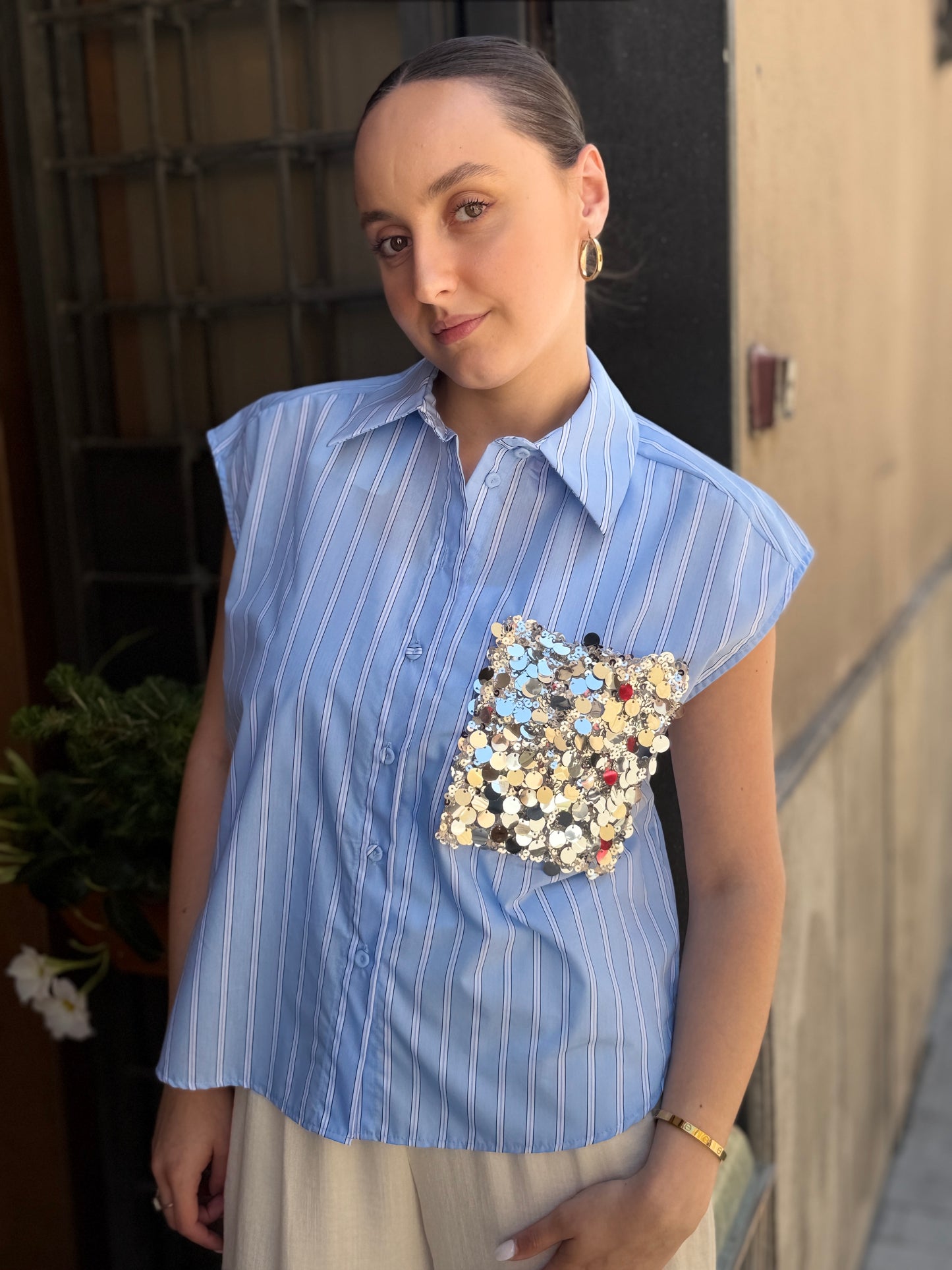 Tensione in camicia bacchettata con tasca  paillettes