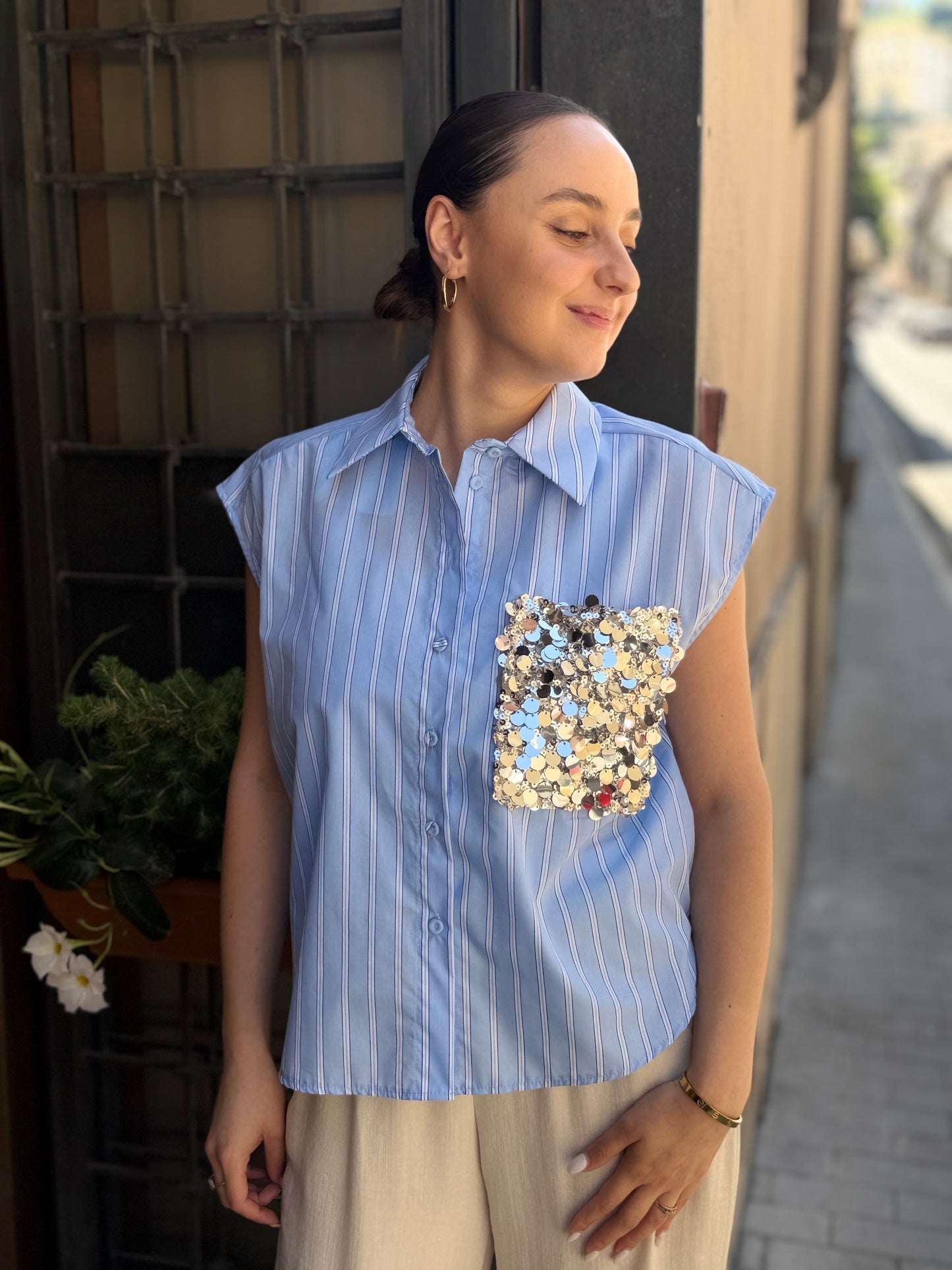 Tensione in camicia bacchettata con tasca  paillettes