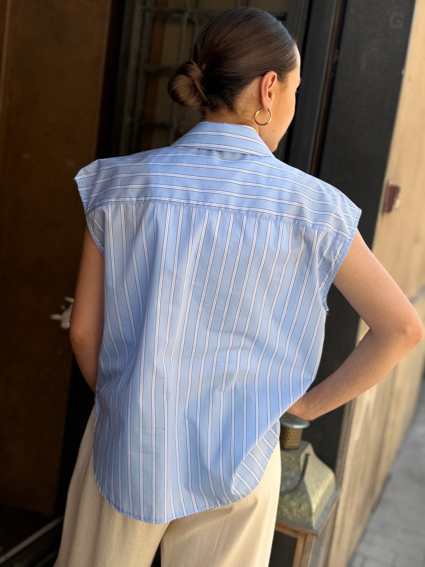 Tensione in camicia bacchettata con tasca  paillettes